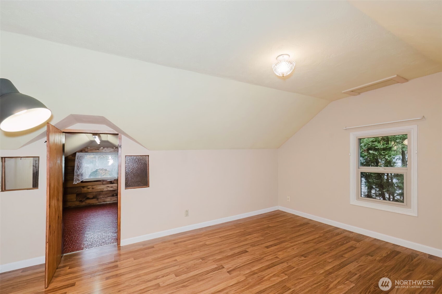 3126 Rocky Point Road Northwest Bremerton, WA 98312 - Photo 29 of 40 a view of empty room with wooden floor and fan