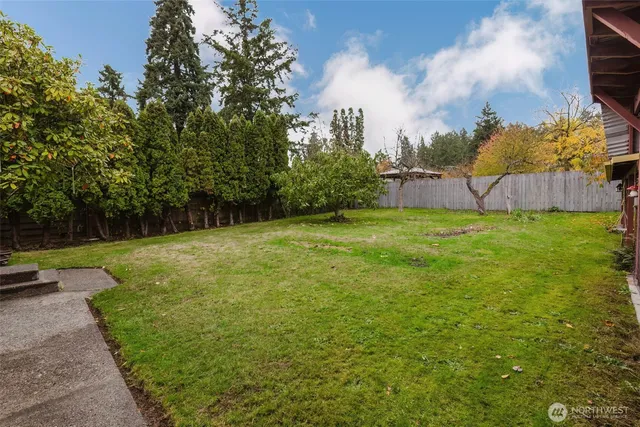 a view of a house with a tree