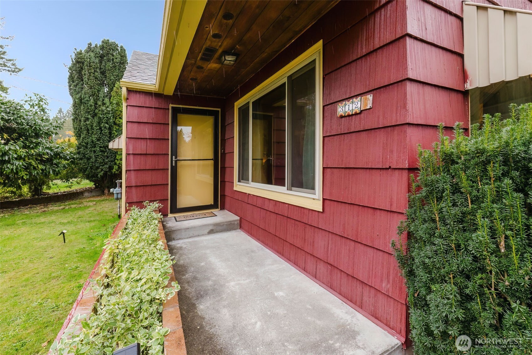 3126 Rocky Point Road Northwest Bremerton, WA 98312 - Photo 4 of 40 a view of a back yard of the house