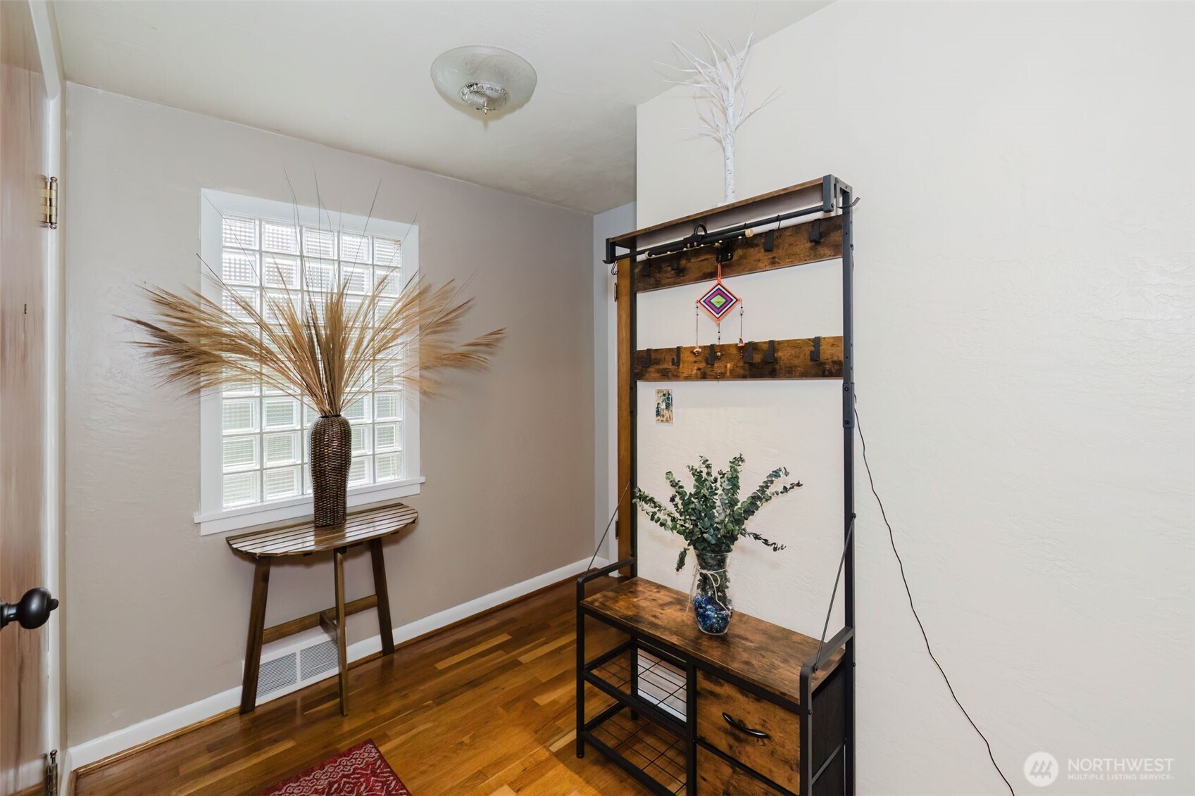 3126 Rocky Point Road Northwest Bremerton, WA 98312 - Photo 6 of 40 a living room with furniture and a potted plant