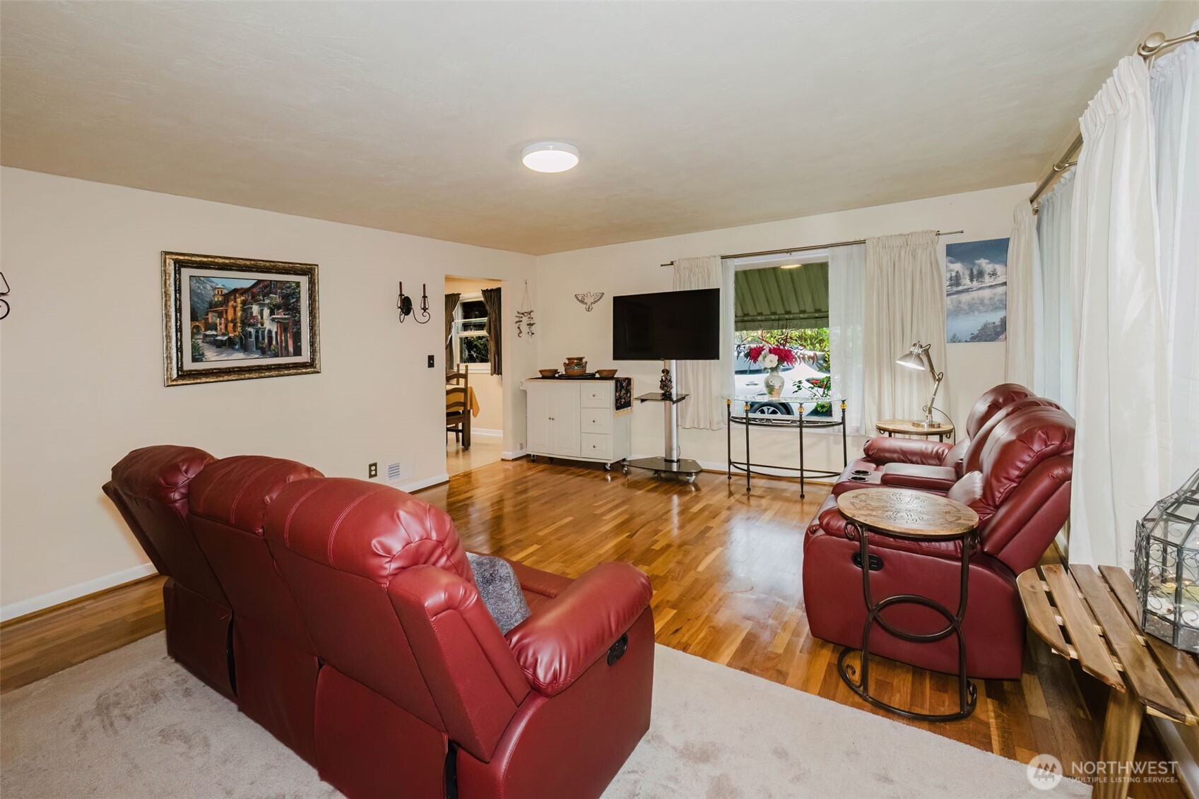 3126 Rocky Point Road Northwest Bremerton, WA 98312 - Photo 7 of 40 a living room with furniture and a flat screen tv