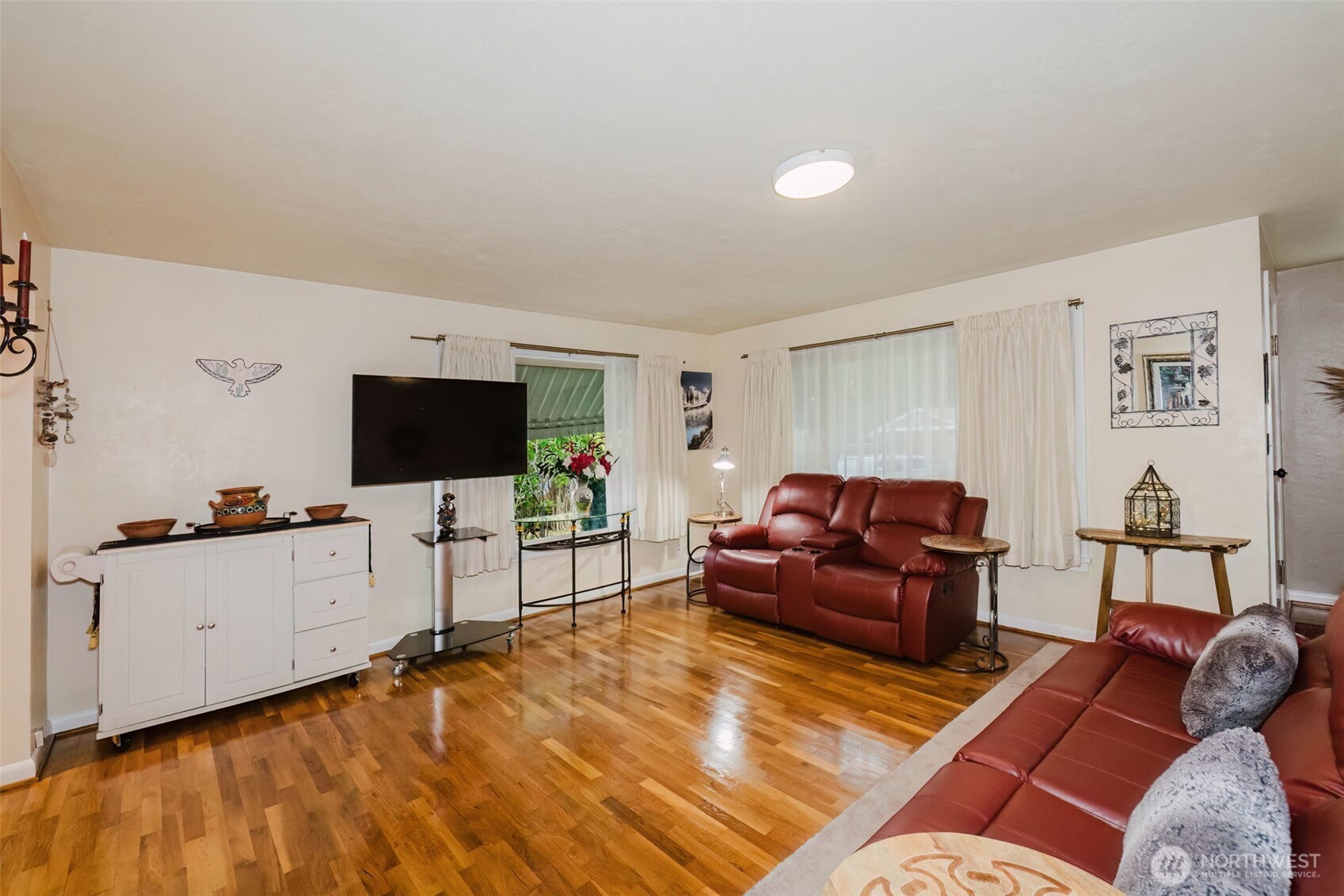 3126 Rocky Point Road Northwest Bremerton, WA 98312 - Photo 8 of 40 a living room with furniture and a flat screen tv