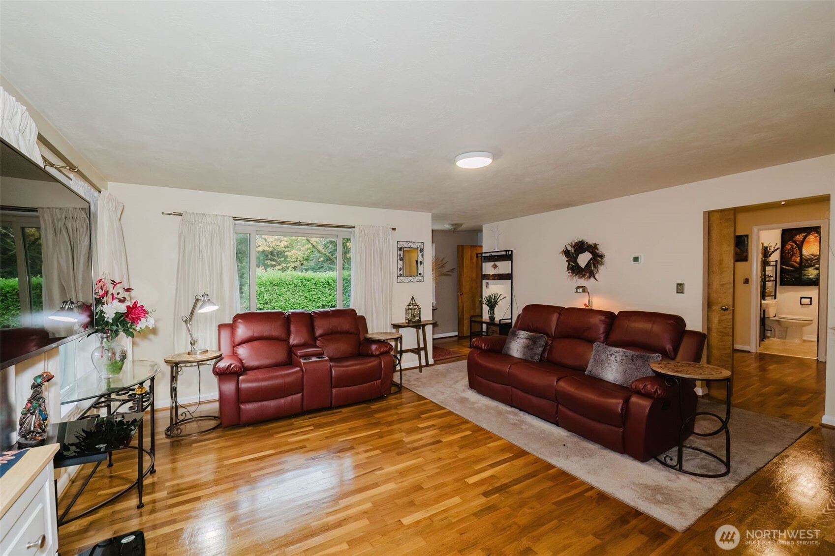 3126 Rocky Point Road Northwest Bremerton, WA 98312 - Photo 9 of 40 a living room with furniture window and wooden floor