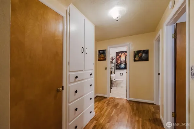 a dining room with furniture and a window