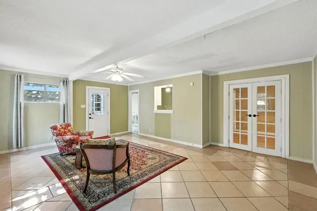 a view of a livingroom with furniture and windows