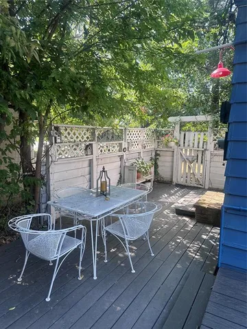 a view of a chairs and table on the wooden floor