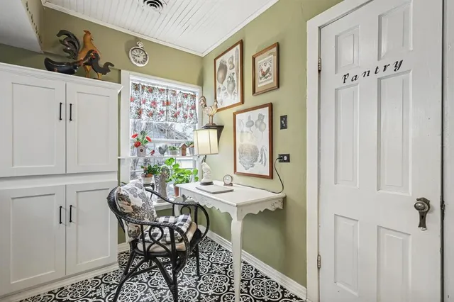 a view of a dining area with furniture and chandelier