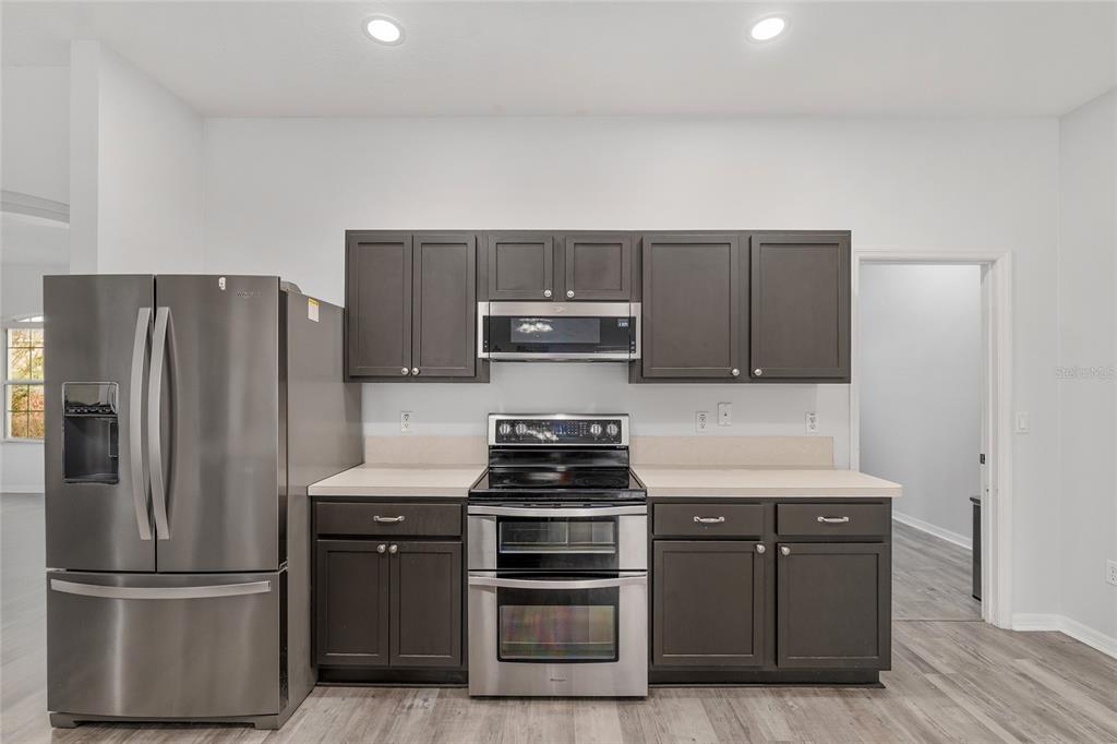 224 Oak Lane Ocala, FL 34472 - Photo 13 of 33 a kitchen with appliances and cabinets