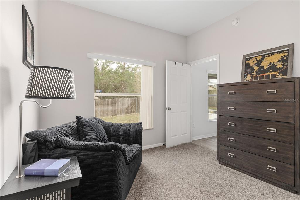 224 Oak Lane Ocala, FL 34472 - Photo 18 of 33 a living room with furniture and a window
