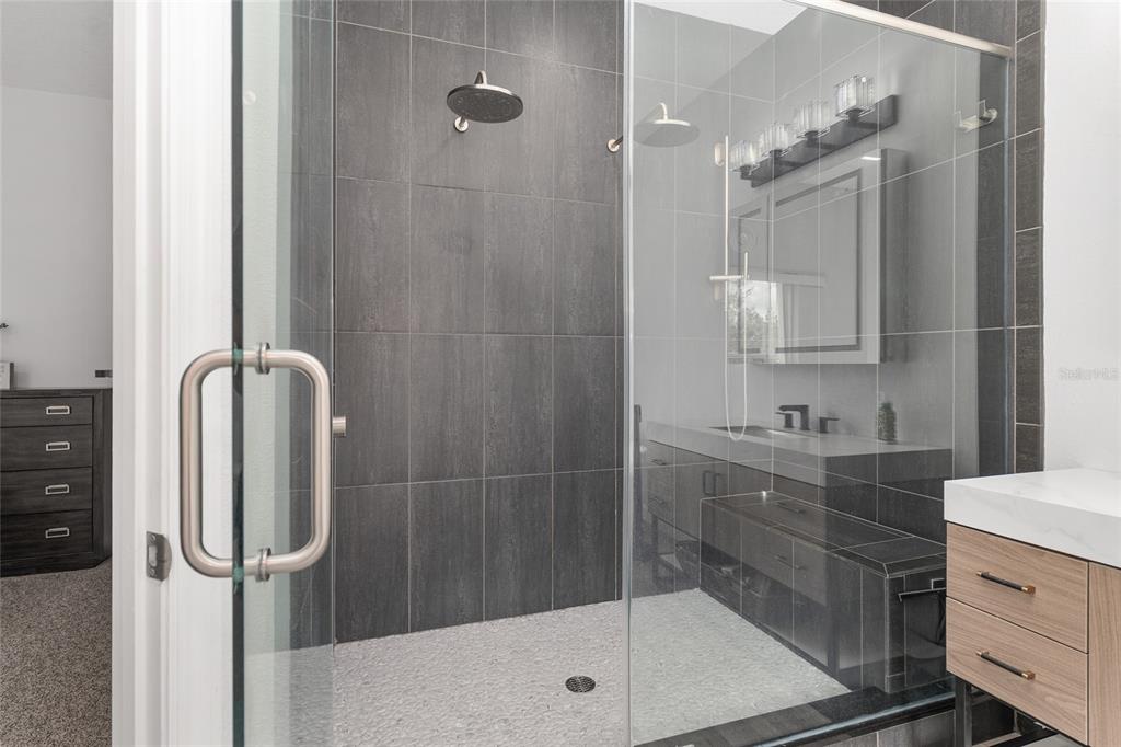 224 Oak Lane Ocala, FL 34472 - Photo 20 of 33 a bathroom with a shower sink and mirror