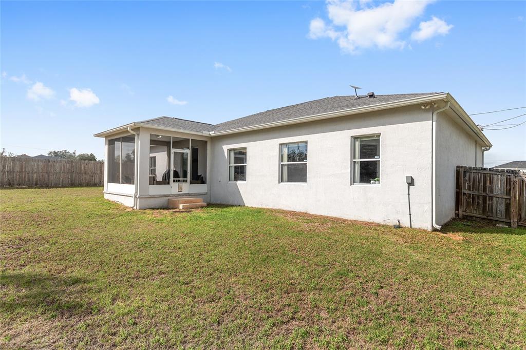 224 Oak Lane Ocala, FL 34472 - Photo 31 of 33 a view of a house with backyard porch and garden