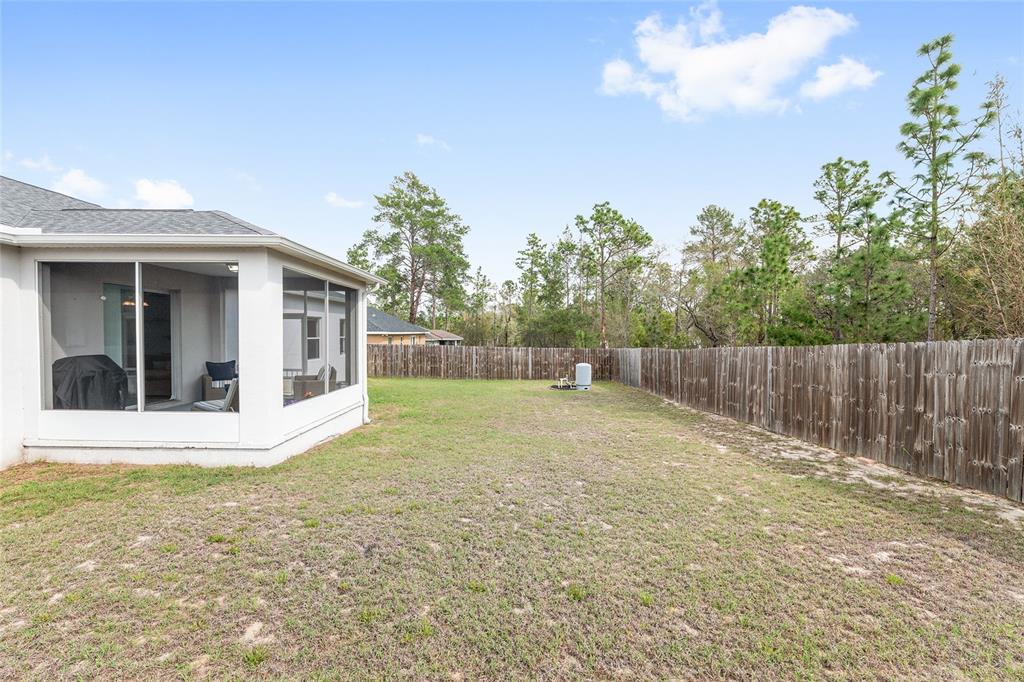 224 Oak Lane Ocala, FL 34472 - Photo 32 of 33 a view of a house with a backyard