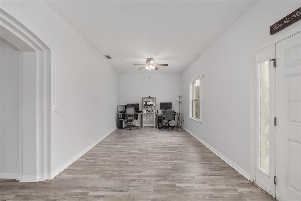 224 Oak Lane Ocala, FL 34472 - Photo 8 of 33 a view of a livingroom with furniture and chandelier
