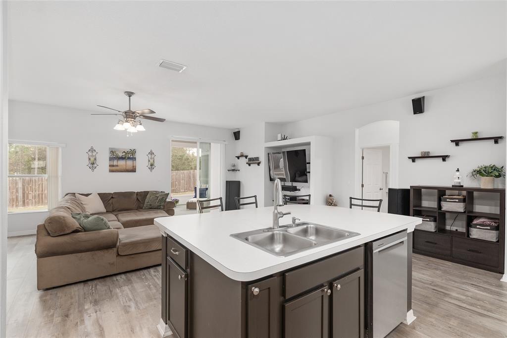 224 Oak Lane Ocala, FL 34472 - Photo 10 of 33 a living room with stainless steel appliances kitchen island furniture and a kitchen view