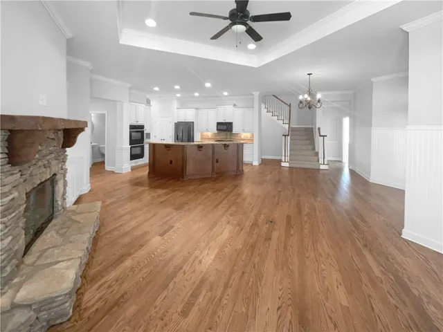 a view of kitchen with cabinets and wooden floor