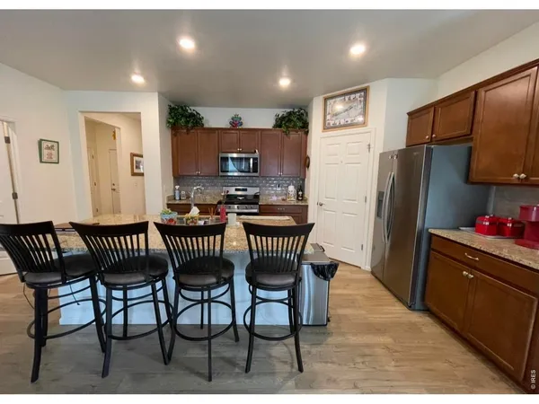 a bathroom with a double vanity sink a mirror and a shower
