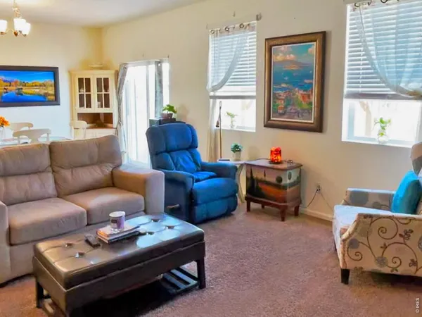 a bedroom with 2 bed and a window