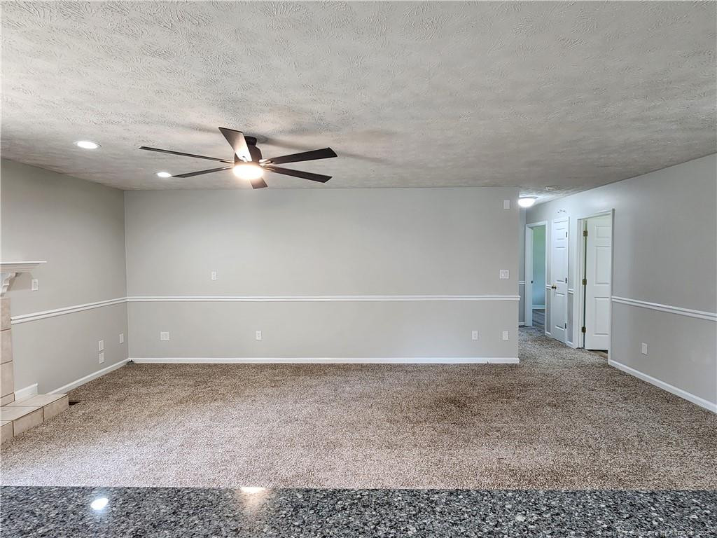 5444 Rockfish Road Raeford, NC 28376 - Photo 13 of 37 a view of a room with a white wall and a ceiling fan