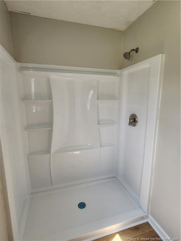 5444 Rockfish Road Raeford, NC 28376 - Photo 18 of 37 a bathroom with a shower