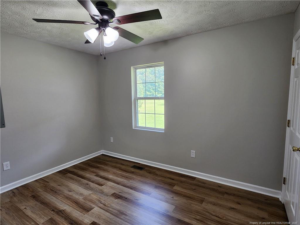 5444 Rockfish Road Raeford, NC 28376 - Photo 20 of 37 wooden floor in an empty room with a window