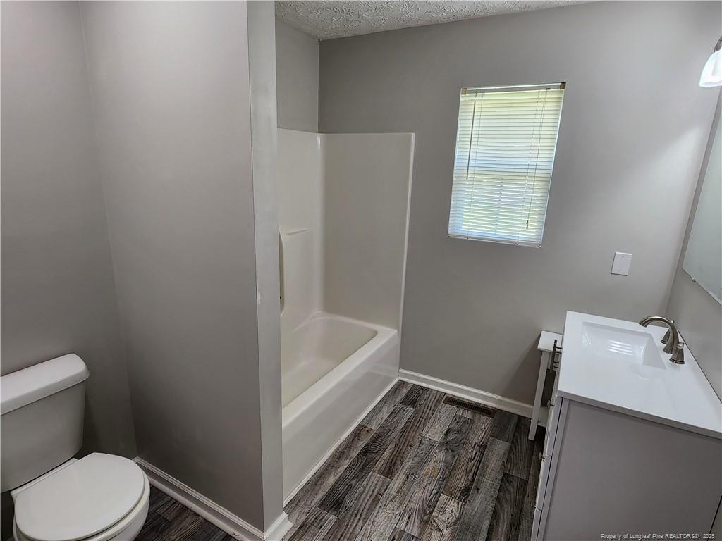 5444 Rockfish Road Raeford, NC 28376 - Photo 23 of 37 a bathroom with a sink and a toilet