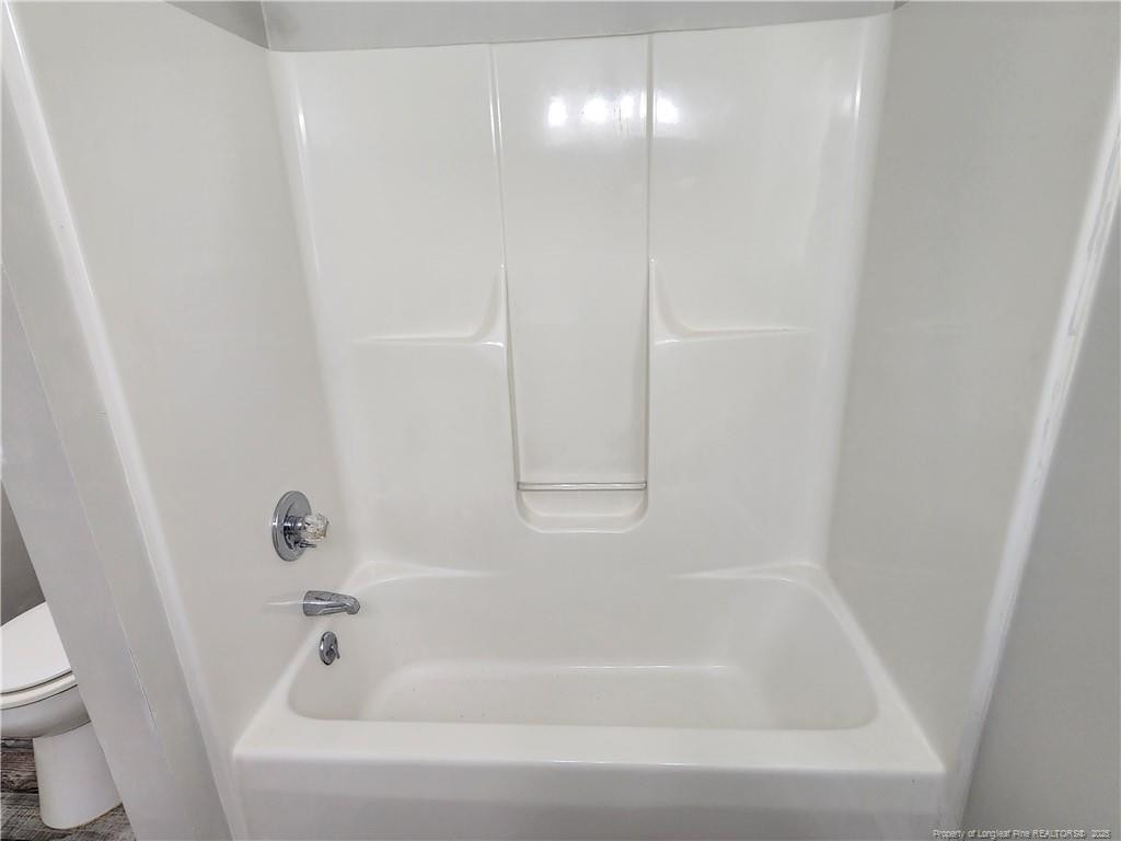 5444 Rockfish Road Raeford, NC 28376 - Photo 25 of 37 a close view of a bathtub in bathroom