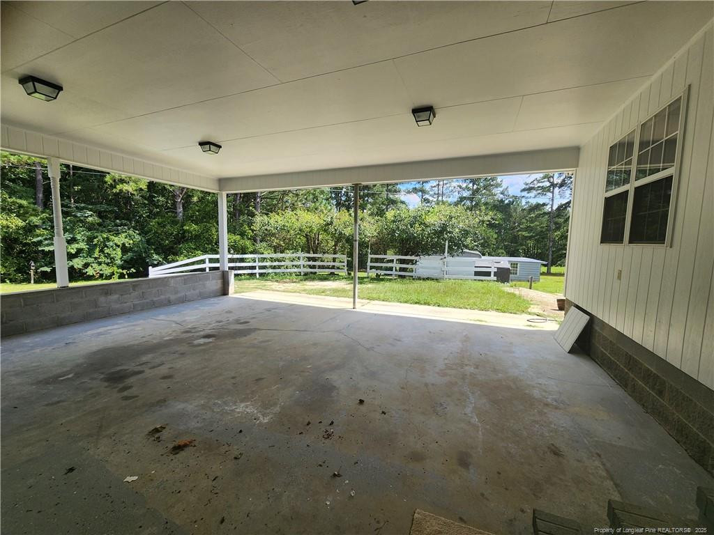 5444 Rockfish Road Raeford, NC 28376 - Photo 31 of 37 a view of a house with a swimming pool