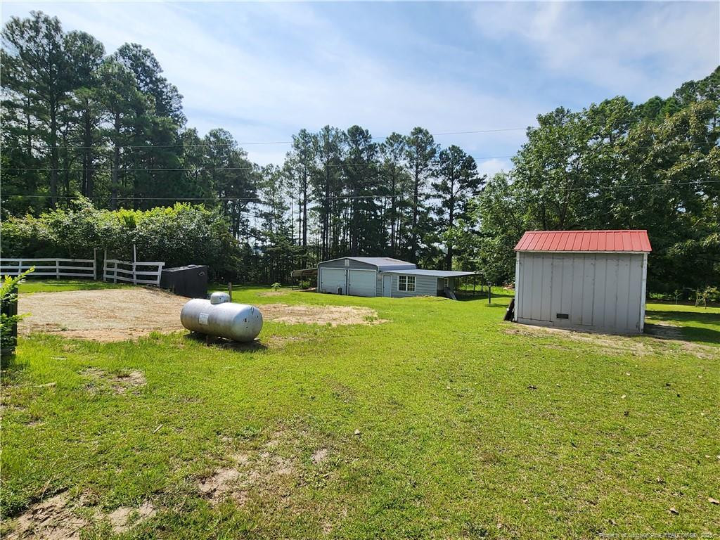 5444 Rockfish Road Raeford, NC 28376 - Photo 32 of 37 a view of a backyard with swimming pool