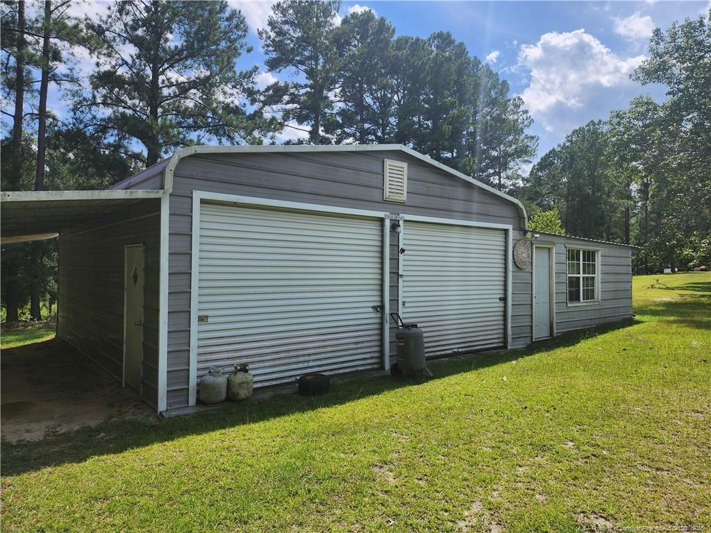 5444 Rockfish Road Raeford, NC 28376 - Photo 35 of 37 a view of a back yard of the house
