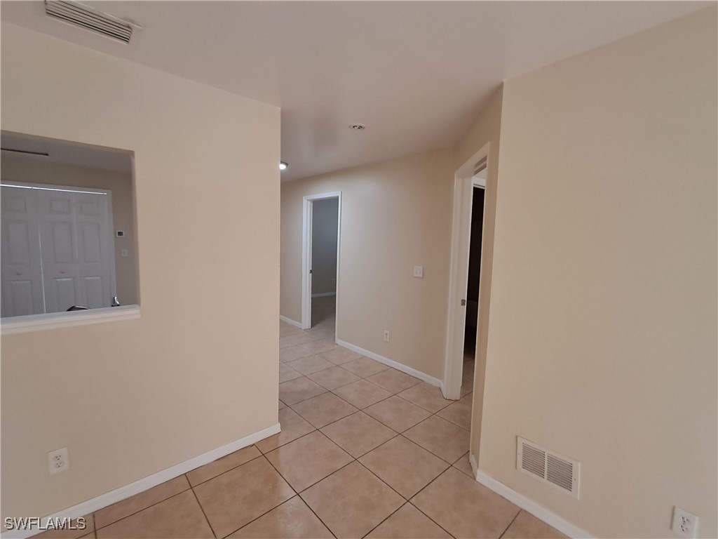 133 Meadow Road Lehigh Acres, FL 33973 - Photo 9 of 12 a view of a hallway