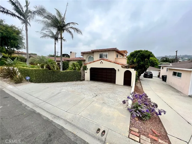 an outdoor space with furniture and umbrella