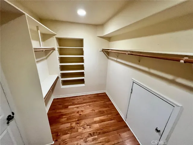 a bathroom with a granite countertop sink and white cabinets