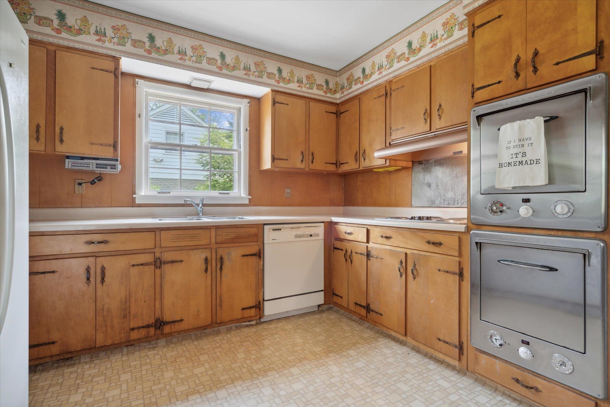 5440 Walnut Grove Road Memphis, TN 38120 - Photo 13 of 25 a kitchen with cabinets appliances and a window