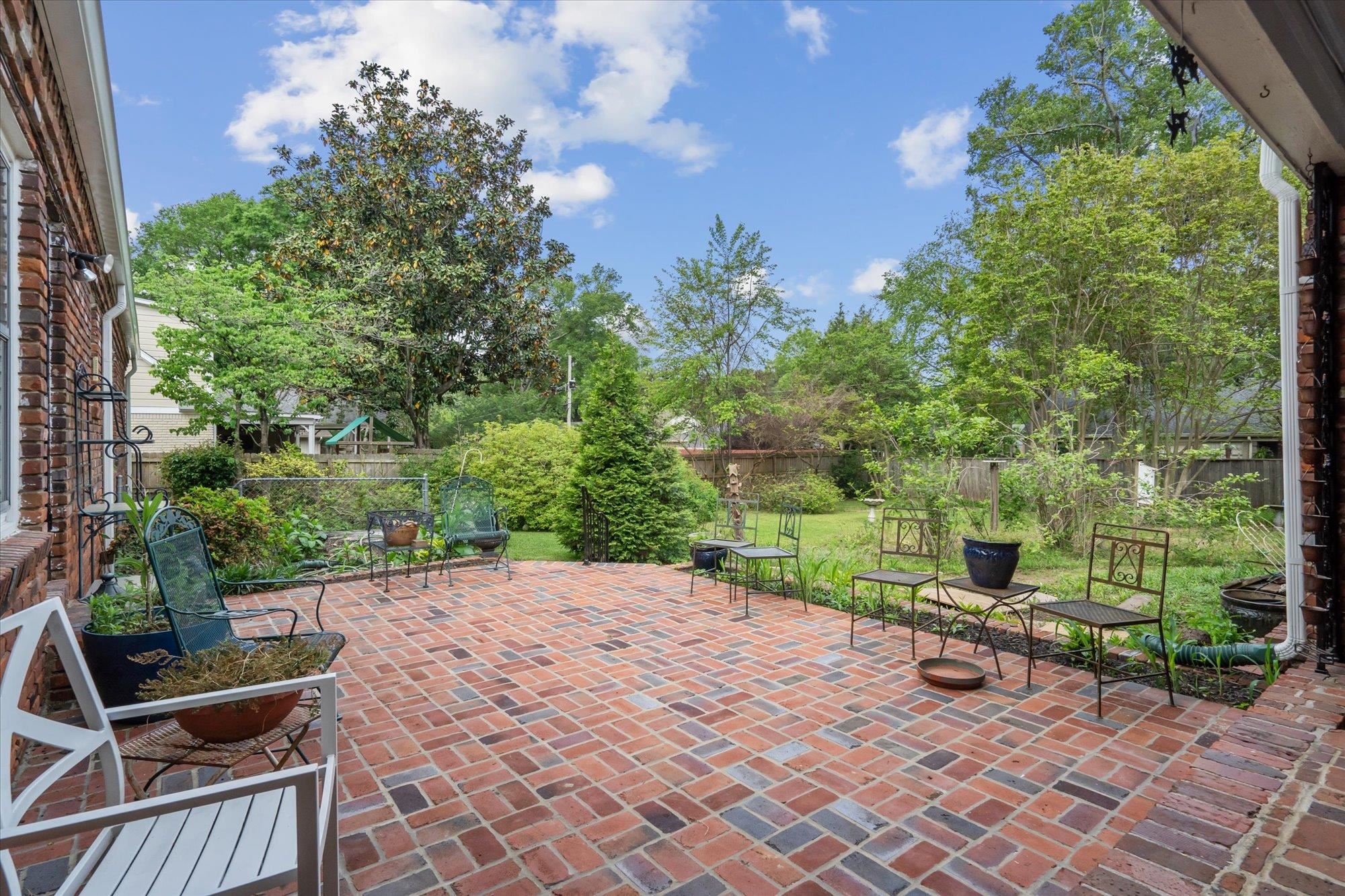 5440 Walnut Grove Road Memphis, TN 38120 - Photo 21 of 25 an outdoor view of garden with patio