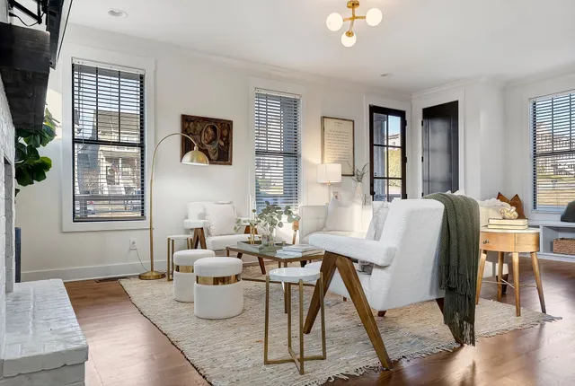 a living room with furniture and windows