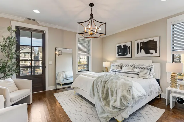 a bedroom with a bed a couch and dresser