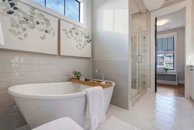 a bathroom with a bathtub and shower
