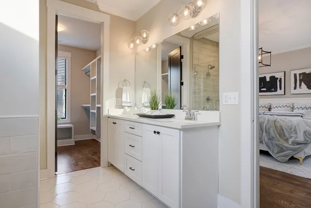 a bathroom with a double vanity sink and mirror