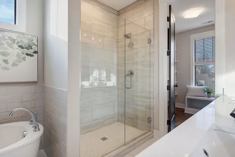 a bathroom with a bathtub and shower