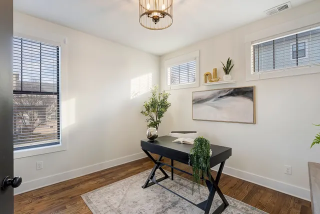 a workspace with furniture and a window