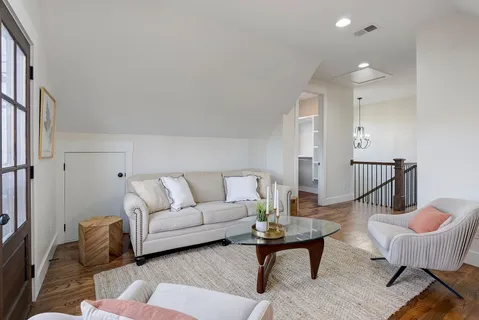 a living room with furniture and a table