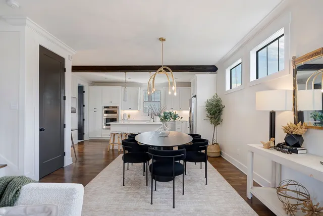 a dining room with furniture and window
