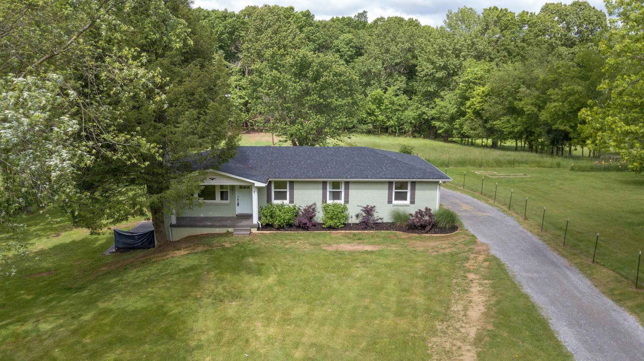 7373 Harper Road Joelton, TN 37080 - Photo 1 of 30 This all brick main level home in a gorgeous lush green setting on 1.64 acres in Joelton is ready for a new owner~