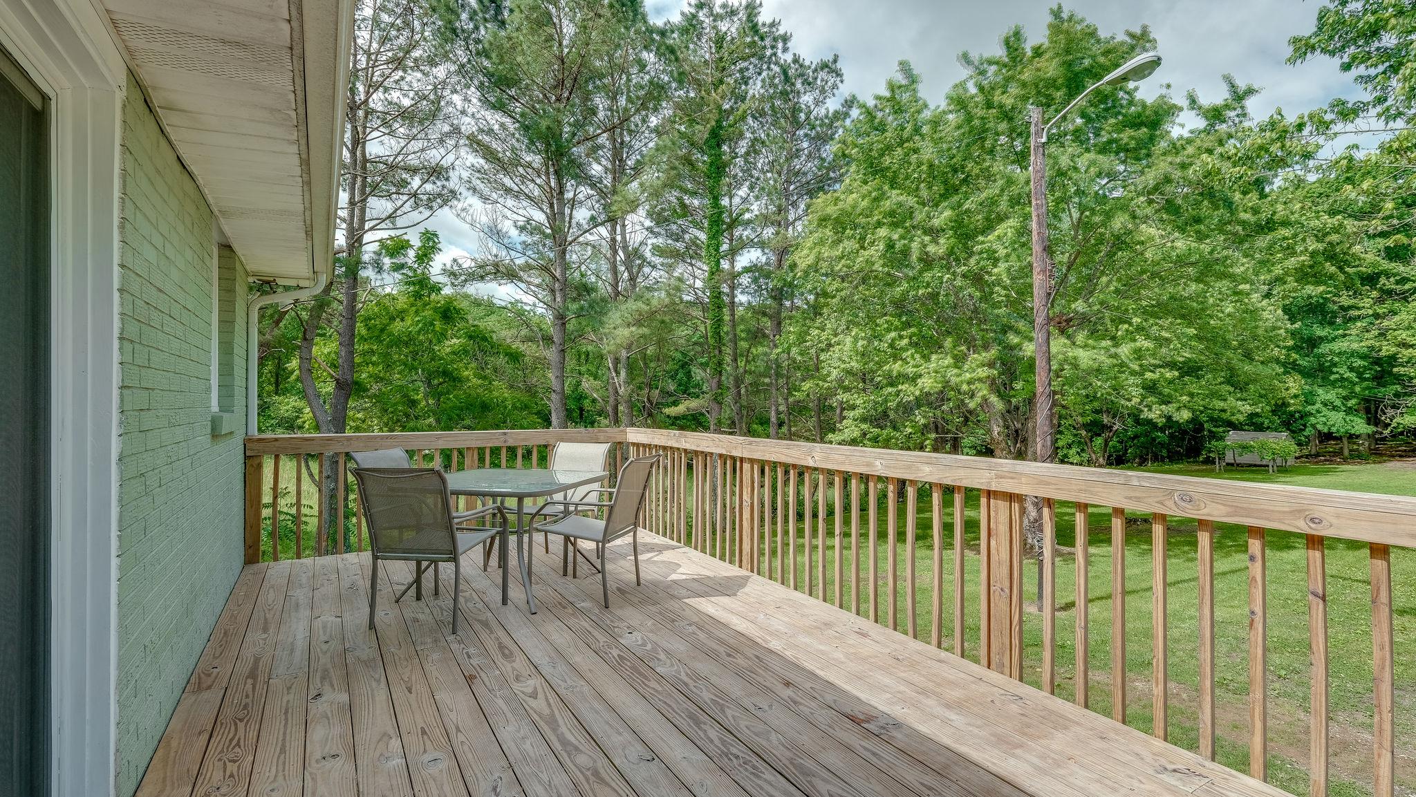 7373 Harper Road Joelton, TN 37080 - Photo 11 of 30 ...there is this wonderful deck. This area is perfect for dining outside, entertaining family & friends this summer, or simply sitting & sipping a cold drink & watching the stars after dark~