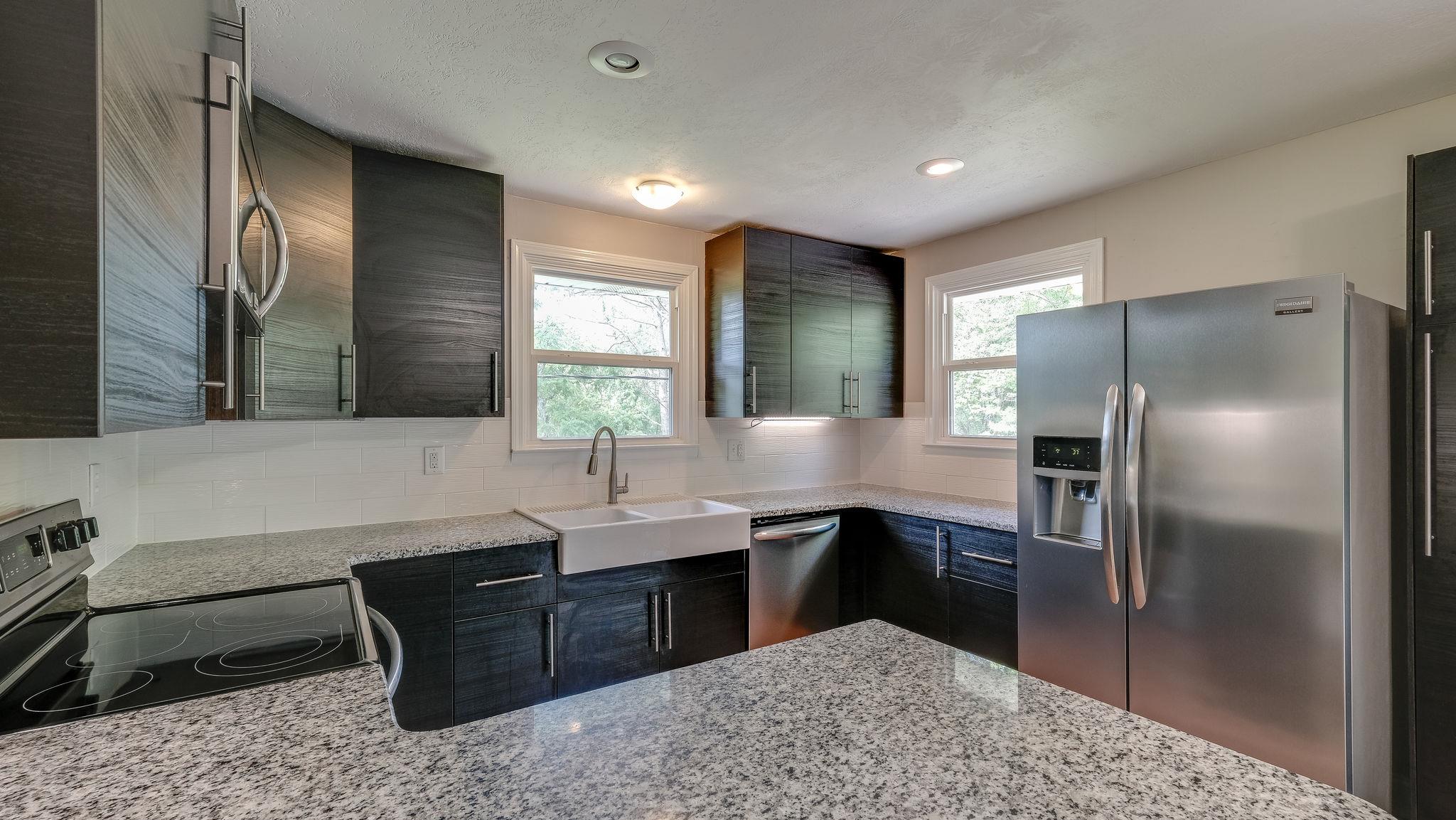 7373 Harper Road Joelton, TN 37080 - Photo 14 of 30 A farmhouse kitchen sink finishes the look~