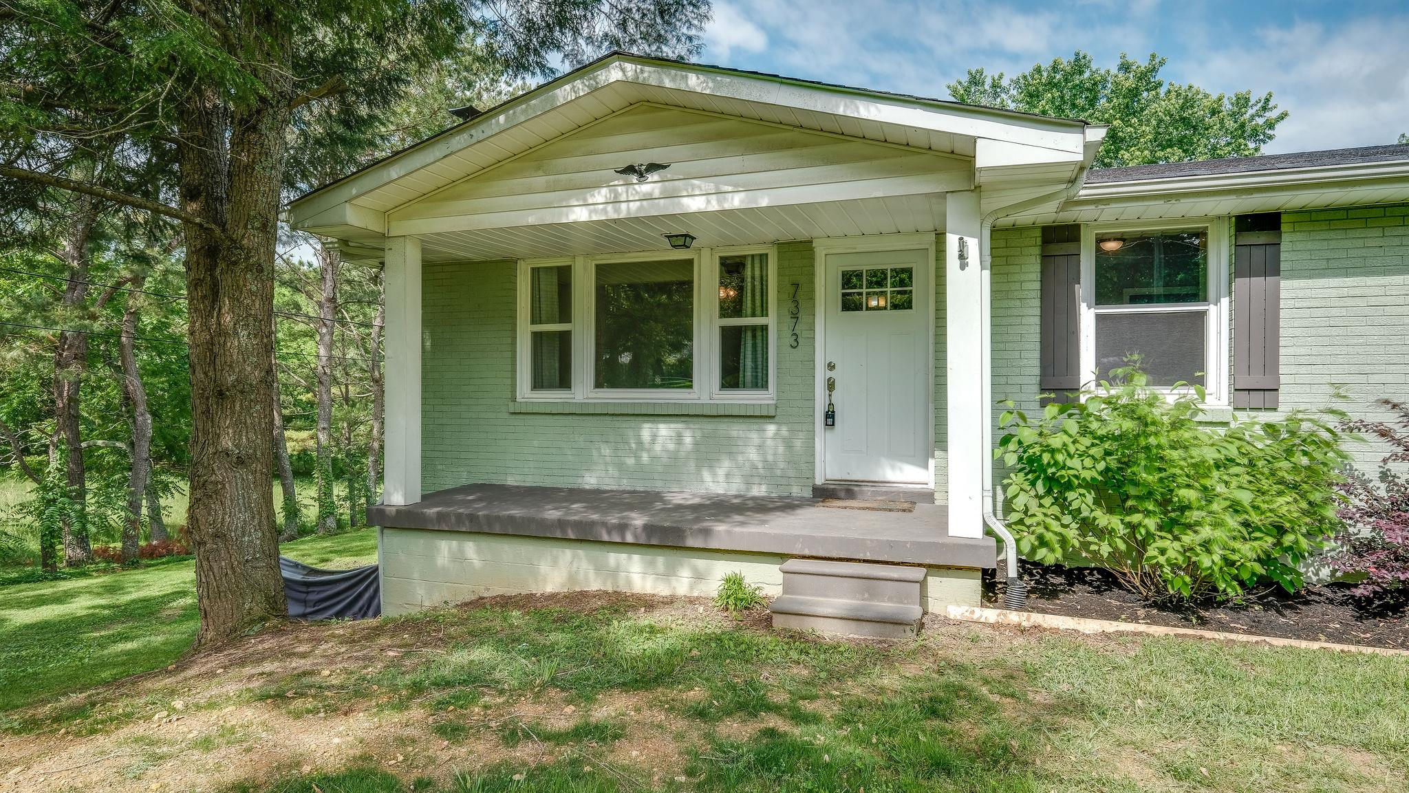 7373 Harper Road Joelton, TN 37080 - Photo 6 of 30 This sweet covered front porch will be a nice place to sit this summer and fall~There is room for table and chairs~