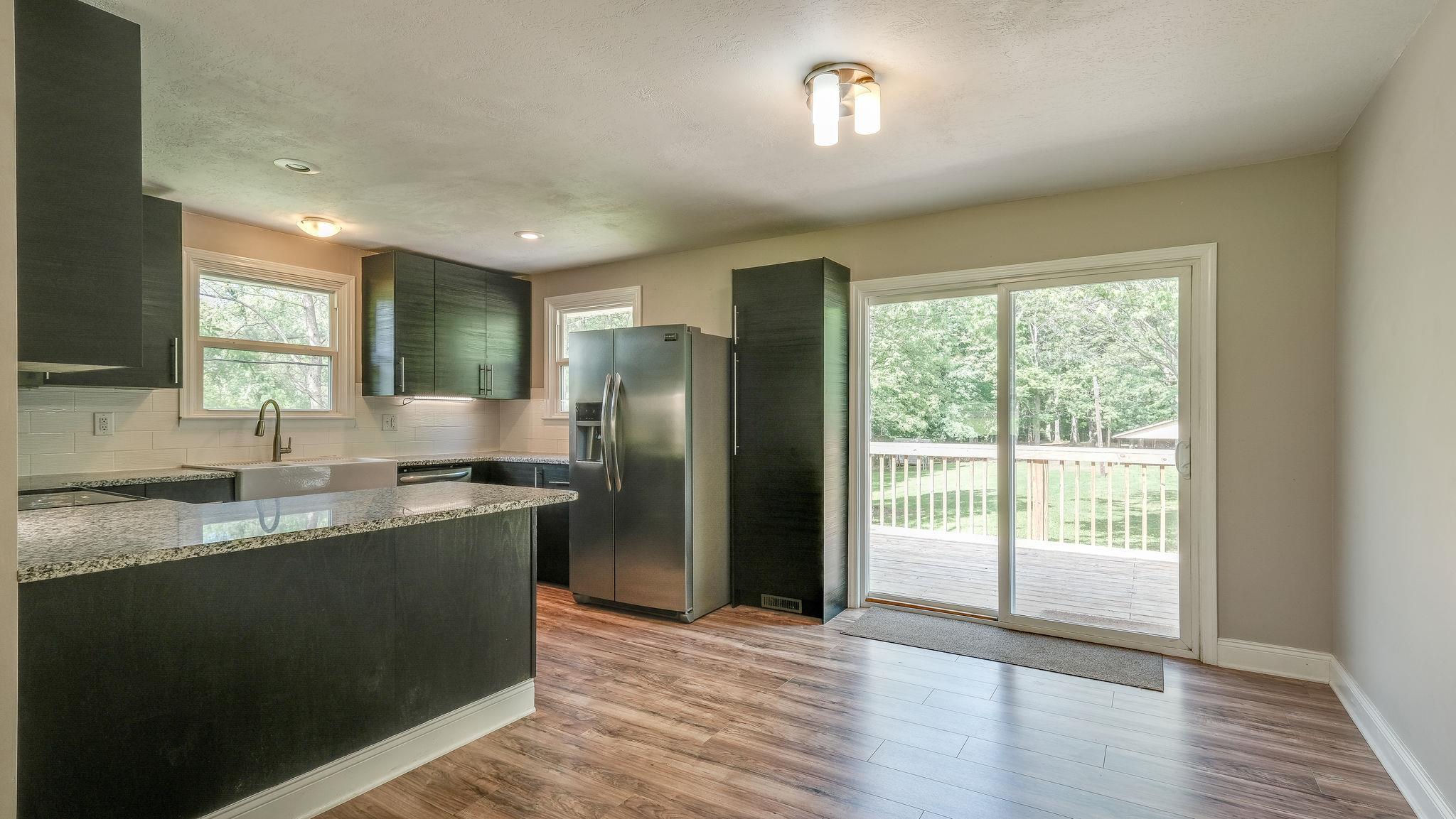 7373 Harper Road Joelton, TN 37080 - Photo 10 of 30 Another view of the kitchen layout and as you move through the sliding doors....