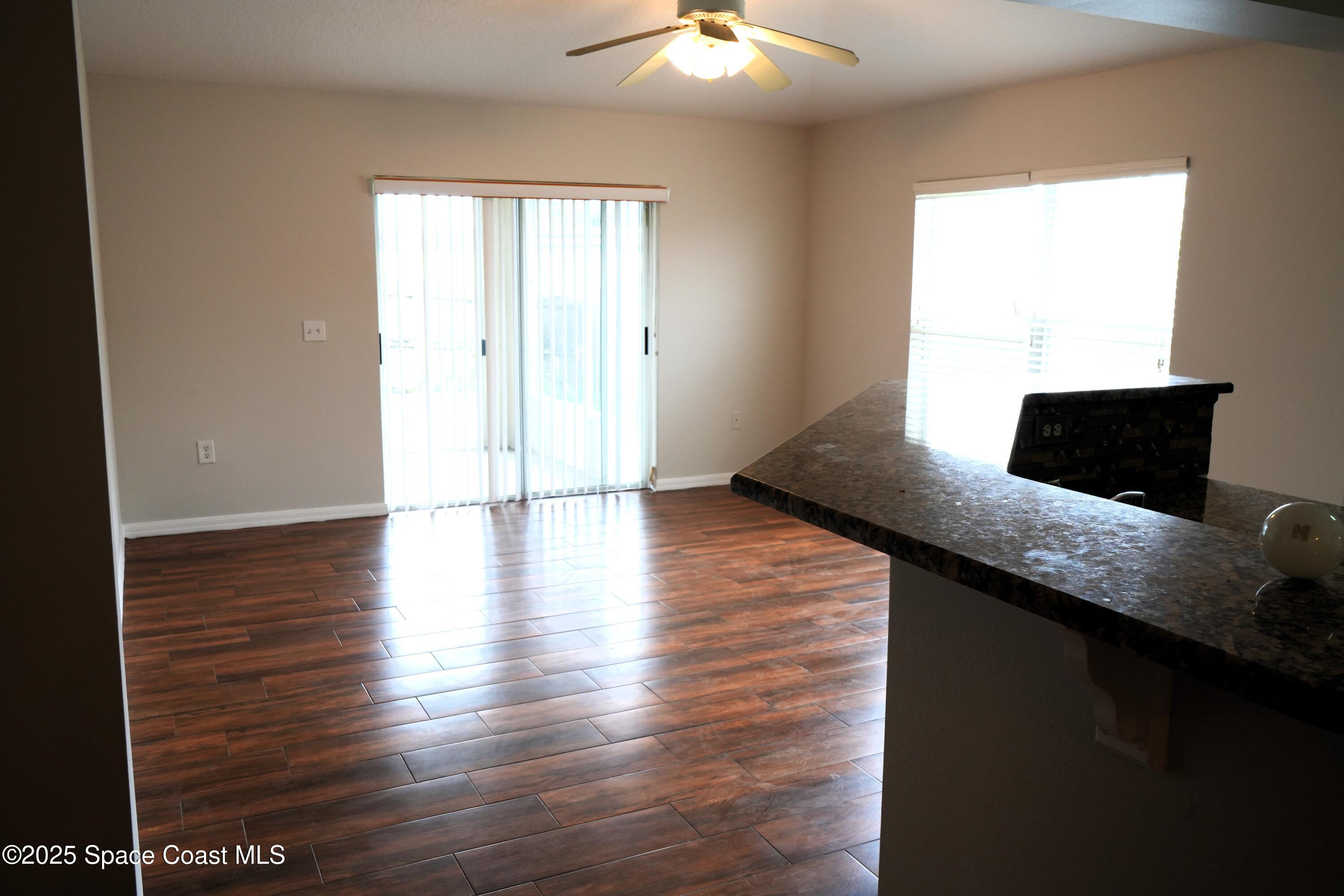 2125 Canopy Drive Melbourne, FL 32935 - Photo 15 of 18 a view of empty room with wooden floor and fan