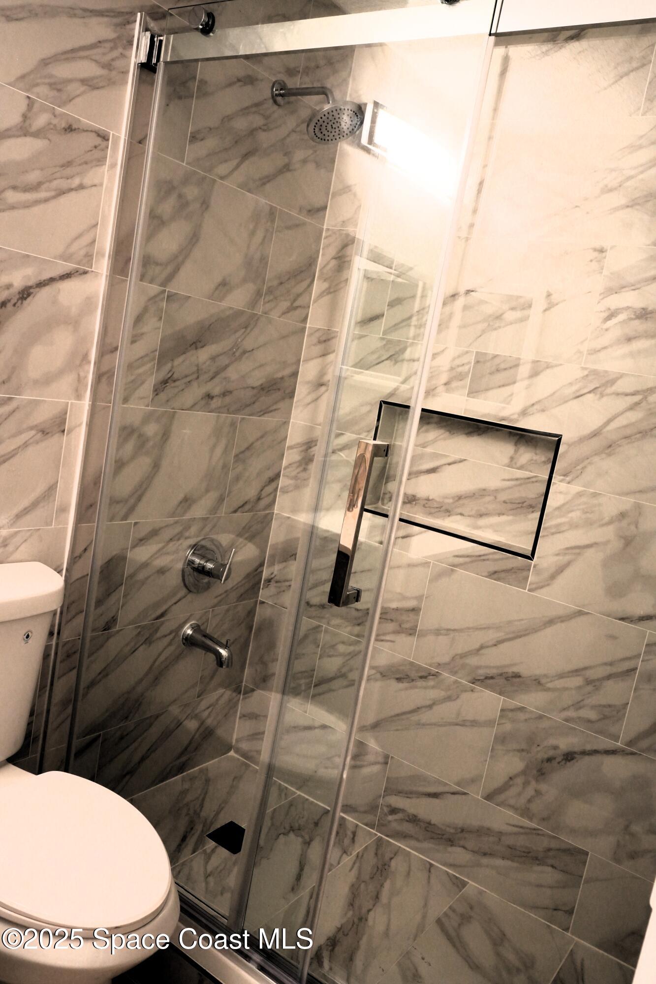 2125 Canopy Drive Melbourne, FL 32935 - Photo 5 of 18 a bathroom with a toilet and a shower