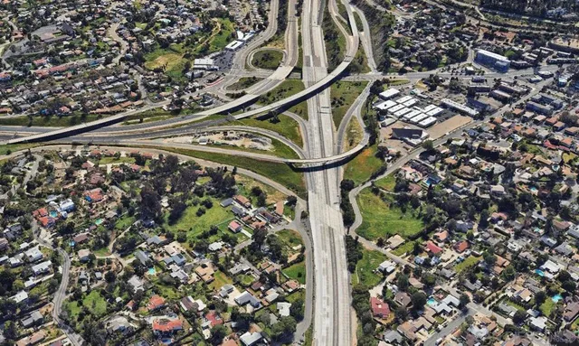 an aerial view of houses with outdoor space